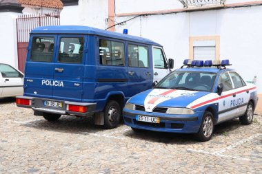 EVORA, PORTUGAL - JUNE 3, 2018: Mitsubishi car and Iveco van of Portugal Police. The full name of the Portuguese force is Public Security Police (PSP).