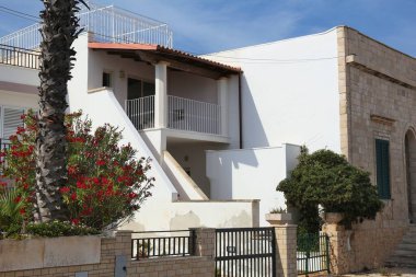 SALENTO, ITALY - JUNE 2, 2017: Public street view of Italian villa in Salento peninsula in Apulia region.