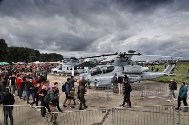 OSTRAVA, CZECHIA - SEPTEMBER 17, 2022: Visitors admire helicopters of United States Marine Corps presented on NATO Days air show in Czech Republic.