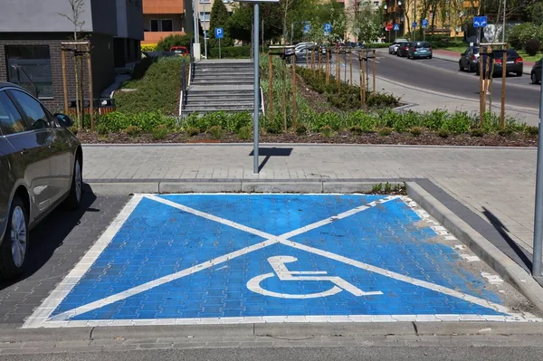 Accessible parking space. Disabled street parking spot in Knurow, Poland.