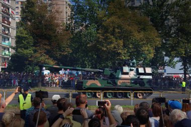 KATOWICE, POLAND - AUGUST 15, 2019: People visit the parade for Armed Forces Day (Polish: Swieto Wojska Polskiego) in Katowice. AHS Krab 155 mm NATO-compatible self-propelled tracked gun-howitzer.