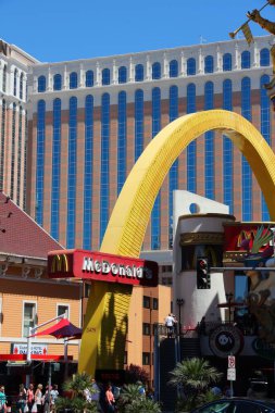 LAS VEGAS, USA - APRIL 14, 2014: People visit McDonald's at the famous Strip in Las Vegas. 15 of 25 largest hotels in the world are located at the strip with more than 60 thousand rooms.