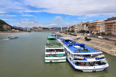 BUDAPEST, HUNGARY - JUNE 20, 2014: River cruise ships moored at Danube embankment in Budapest, the largest city in Hungary.