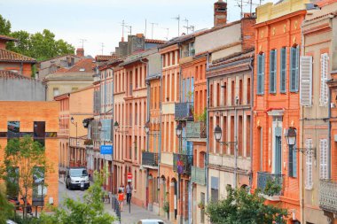 TOULOUSE, FRANCE - SEPTEMBER 28, 2021: People visit Toulouse city, St-Cyprien district. Toulouse is the 4th largest commune in France. clipart