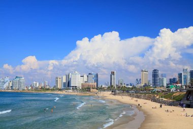 TEL AVIV, ISRAEL - NOVEMBER 2, 2022: People visit Alma Beach in Tel Aviv, Israel. Tel Aviv is the economic and technological center of Israel.