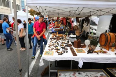 KLAGENFURT, AUSTRIA - AUGUST 12, 2022: People visit Altstadtsauber flea market in Klagenfurt, Austria. Klagenfurt is the 6th largest city in Austria.