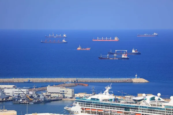 HAIFA, ISRAEL - OCTOBER 31, 2022: Ships waiting for entry to Port of Haifa, a major seaport in Israel. One of 3 major ports in Israel.
