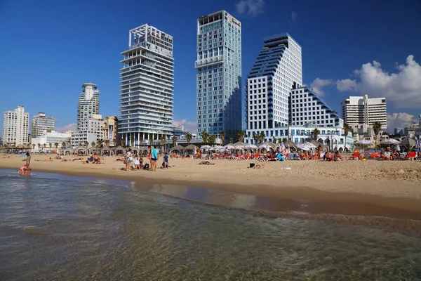 TEL AVIV, ISRAEL - NOVEMBER 2, 2022: People visit Allenby Beach (also known as Jerusalem Beach) in Tel Aviv, Israel. Tel Aviv is the economic and technological center of Israel.