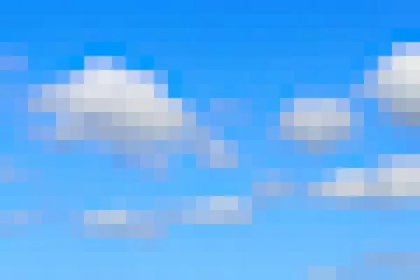 Pixel sky background. Blue sky and white clouds. Video game 8-bit style background texture.