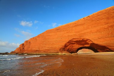 Morocco nature. Natural sedimentary rock arch and sandy beach in Legzira, near Sidi Ifni, Morocco.