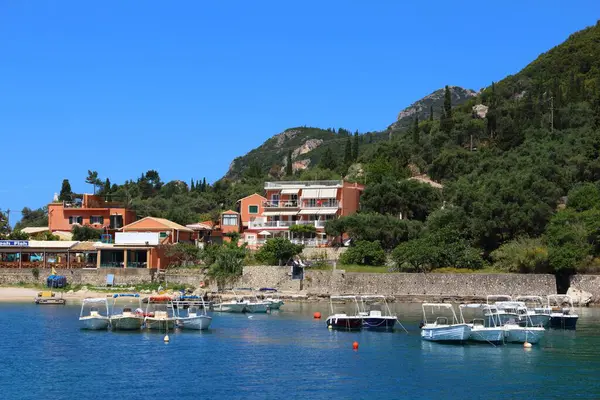 CORFU, GREECE - 2 Haziran 2016: Paleokastritsa 'da balıkçılık limanı, Corfu Adası, Yunanistan. 2012 yılında Korfu 'yu 558 bin turist ziyaret etti.