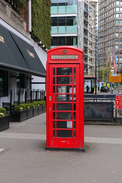 LONDON, UK - APRIL 23, 2016: Telephone booth in London, UK. London is the most populous city in the UK with 13 million people living in its metro area.