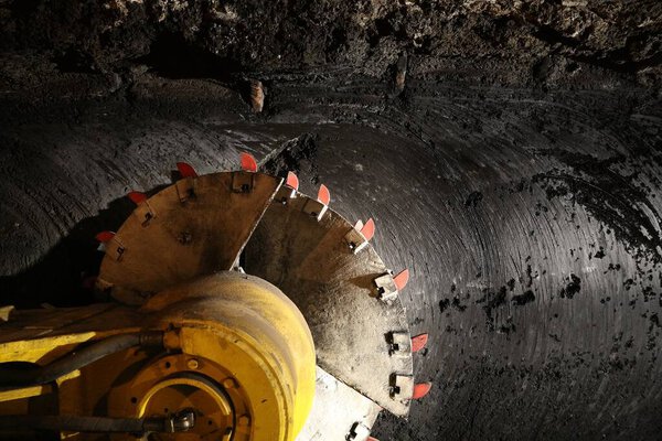 Longwall mining shearer machine. Poland coal mine interior - underground tunnel. Industry in Zabrze, Upper Silesia.