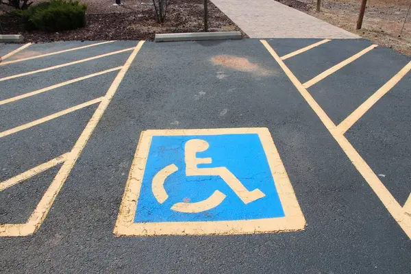 Reserved accessible parking spot - transportation infrastructure road markings.