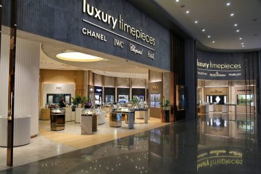 ISTANBUL, TURKEY - APRIL 11, 2023: Luxury watches duty free shop at Istanbul Airport, one of busiest airports in the world. Multiple brand store with Chanel, IWC, Chopard, Piaget and Hublot watches. clipart