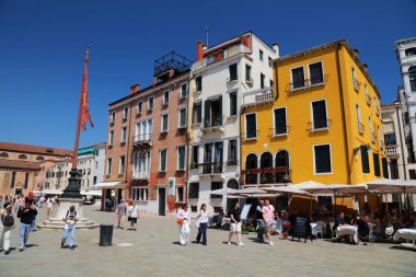 VENICE, ITALY - MAY 21, 2023: Tourists visit Campo Santo Stefano square in Venice, Italy. Venice is a UNESCO World Heritage Site. clipart