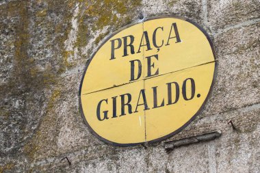 Evora architecture feature in Portugal. Street sign with square name: Praca de Giraldo. clipart