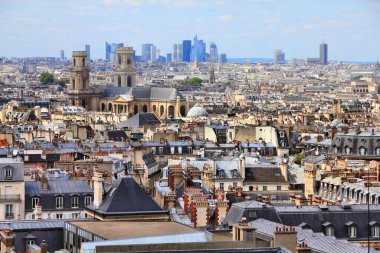 Paris city skyline with 6th Arrondissement, Odeon neighborhood and La Defense district in background. clipart