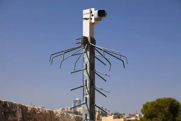 Security camera in Jerusalem city, Israel. CCTV equipment. Security surveillance technology.