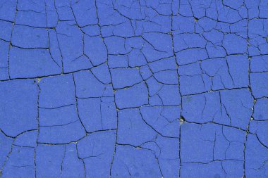Mavi grunge yüzey arka planı. Soyulmuş boyanın geçmişe dönük dokusu. Sıkıntılı çatlak boya kirli arka plan yüzeyi.