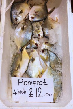 Pomfret price tag at Billingsgate Fish Market in Poplar, London, UK. clipart