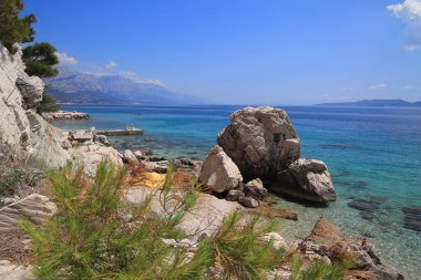 Croatia summer vacation sunny weather. Beautiful landscape in Dalmatia. Marusici beach - Adriatic Sea (Makarska Riviera region). clipart