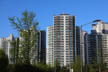 Seoul city view. Tall generic apartment buildings residential neighborhood in Jamsil district (Jamsil-dong). clipart