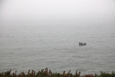 Fishermen of Safi, Morocco. Ocean mist in the air, coastal atmosphere. clipart