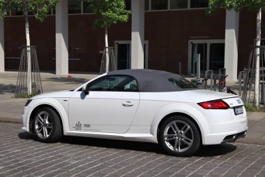 DRESDEN, GERMANY - MAY 10, 2018: Audi TT S-line  high performance convertible car parked in Germany. There were 45.8 million cars registered in Germany (as of 2017). clipart