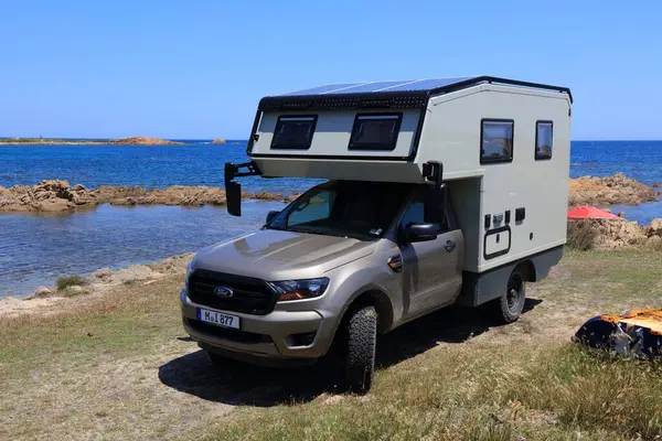 stock image SARDINIA, ITALY - MAY 27, 2023: Off-road 4wd camper van made from Ford Ranger pickup truck parked at Capo Comino in Sardinia.