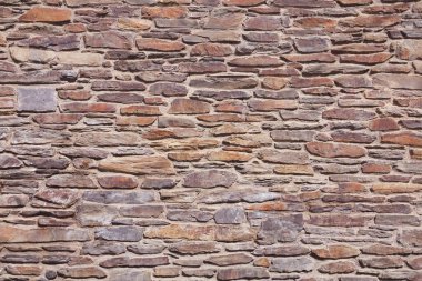 Taş duvar dokusu. Doğal köy geçmişi var. Klasik biçim dokusu.