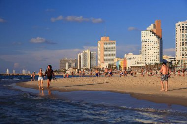 TEL AVIV, ISRAEL - NOVEMBER 2, 2022: People visit Allenby Beach (also known as Jerusalem Beach) in Tel Aviv, Israel. Tel Aviv is the economic and technological center of Israel.