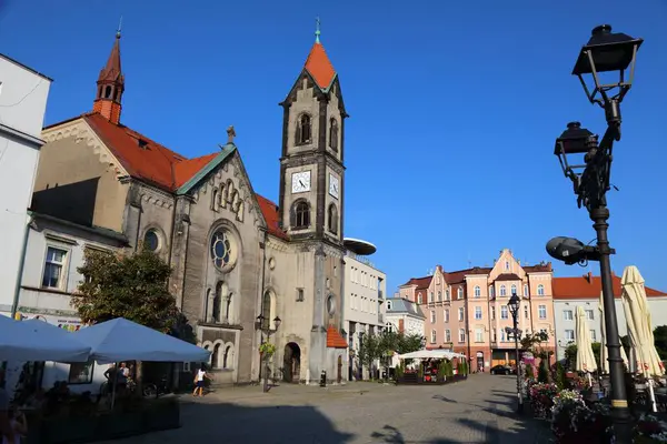 stock image TARNOWSKIE GORY, POLAND - AUGUST 28, 2024: People visit the main square (Rynek) during summer in Tarnowskie Gory, Poland.