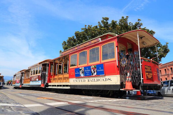 SAN FRANCISCO, USA - APRIL 8, 2014: Historic cable car in San Francisco, USA. Famous SF streetcars began operation in 1878. Alcatraz can be seen in background.