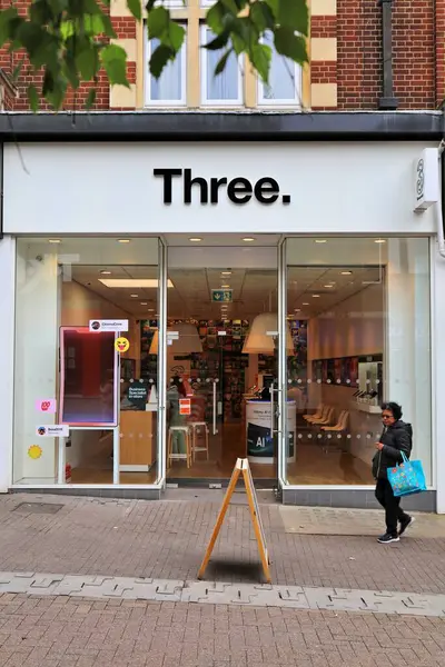 stock image SUTTON, UK - JULY 8, 2024: Three UK telecom company, mobile telephone network shop in London Borough of Sutton in South London, UK.