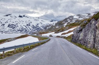 Winter in summer - snow in Norway. Sunnmore Alps road. clipart