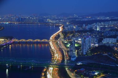 Seoul cityscape in South Korea. Aerial view of night skyline in Dongjak district. Bon-dong and Heukseok-dong neighborhoods. clipart