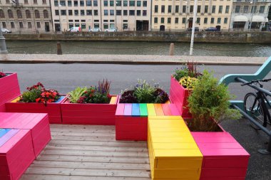 GOTHENBURG, SWEDEN - AUGUST 27, 2018: Rainbow benches in downtown Gothenburg, Sweden. Gothenburg is the 2nd largest city in Sweden with 1 million inhabitants in the metropolitan area. clipart