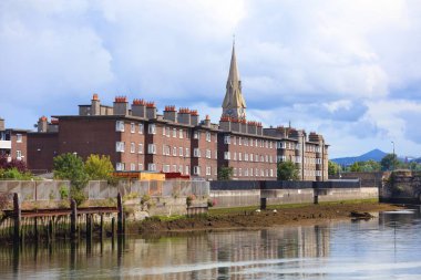 Ringsend neighborhood in Dublin city, Ireland. Cityscape with river Dodder. clipart