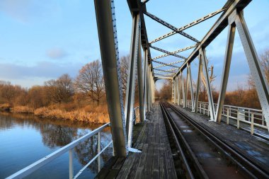 Railway bridge over Gliwice Canal winter view in Pyskowice, Poland. clipart