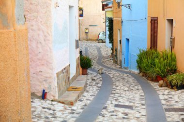 Posada quaint old town street view in Sardinia, Italy. Posada in Province of Nuoro. clipart