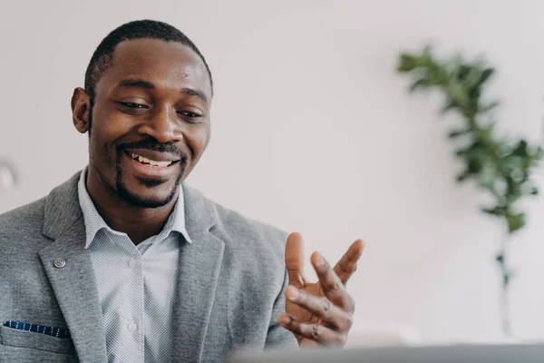 Smiling African American Businessman Holding Video Call Customers Laptop Optimistic — Zdjęcie stockowe