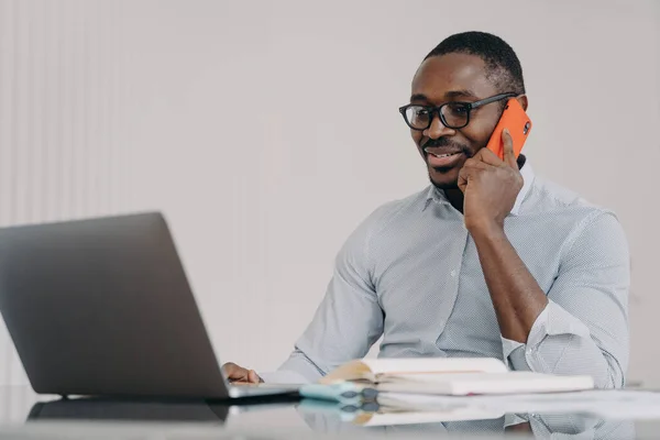 African American Businessman Talks Phone Laptop Office Black Male Manager — Zdjęcie stockowe