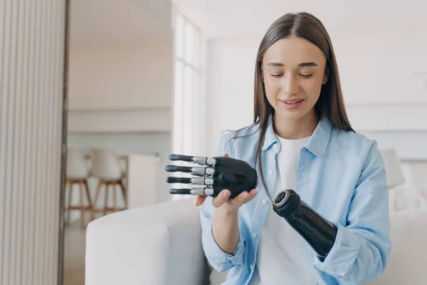 stock image Disabled woman assembles bionic arm with hand. Prosthesis connects at wrist joint.