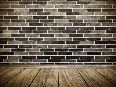 Eski tuğla duvar ve eski ahşap zemin.