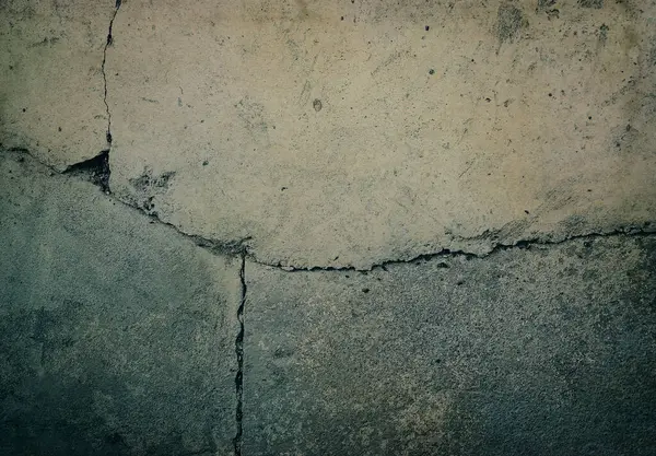 Soyut grunge beton çatlamış duvar dokusu veya arkaplan.