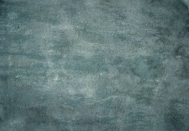 Aged pastel colored grunge concrete wall texture for background.