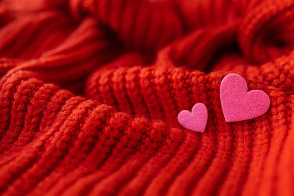stock image Decorative pink heart on a red knitted background, top view. Place for an inscription, horizontal photo