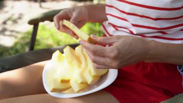 Closeup Hands Young Woman Holding Breaks Piece Sweet Melon Plate — Stock Video