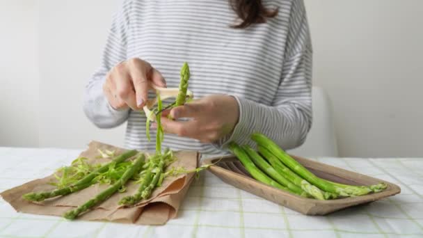 Brunette Woman Peel Asparagus Sitting Table Close Girl Clean Spring — Stock Video